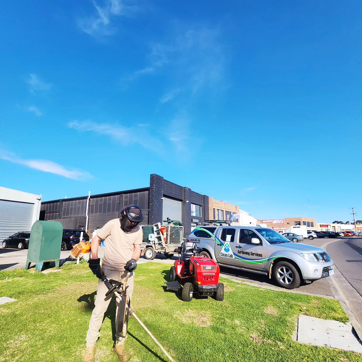 Professional commercial lawn mower and Clean Lab service van.